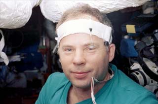 Mir-24 Commander Anatoly Solovyev wears a Night Headband Monitor (NHM) and eye sensor for a sleep study during NASA-6. 